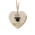 Personalised pet memorial Christmas ornament: white ceramic heart with a pug photo, the name Bella and 2012 – 2025